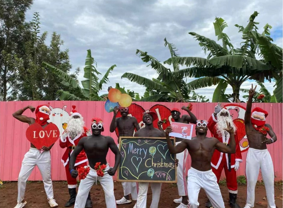 Send festive cheer with a personalized African dance greeting video! Ideal for birthdays, holidays, or special events.
Group of people in festive costumes with a 'Merry Christmas' sign against a 
pink wall.

AfricanJoyflixs, Wishes Made Visual, Wishes From Africa, Africa-Greeting.com, greeting video from Africa, personalized greeting, African dance greeting, birthday greeting video, custom video gift, wishes from Africa,African Birthday Wishes,
Video From Africa, Greeting Dance Video, personalized greeting 
